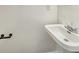 Bathroom featuring a white sink, neutral walls, and modern fixtures at 6628 Dunsdin Dr, Plainfield, IN 46168