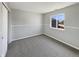 Bedroom featuring a window view, plush carpeting, white walls and closet space at 6628 Dunsdin Dr, Plainfield, IN 46168