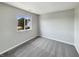 Bright bedroom featuring a window view, plush carpeting and neutral wall paint at 6628 Dunsdin Dr, Plainfield, IN 46168
