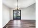 Dining area featuring hardwood floors and french doors, creating an open and inviting space for gatherings at 6628 Dunsdin Dr, Plainfield, IN 46168