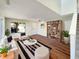 Bright living room with a large window, hardwood floors, stylish furniture, and a bookshelf provides inviting space at 6628 Dunsdin Dr, Plainfield, IN 46168
