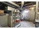 Unfinished basement with exposed pipes and mechanicals at 704 Baronne St, Lebanon, IN 46052