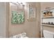 Bathroom features a sink, mirror, toilet, and decorative shelving at 704 Baronne St, Lebanon, IN 46052