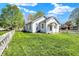Charming home featuring a well-maintained lawn and classic white picket fence under a bright, sunny sky at 704 Baronne St, Lebanon, IN 46052