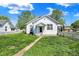 Charming home featuring a well-maintained front yard and white picket fence at 704 Baronne St, Lebanon, IN 46052