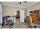 Versatile room set up as a home office with exercise equipment and a view into the living space at 704 Baronne St, Lebanon, IN 46052