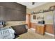 Functional kitchen with upper and lower dark cabinets and lots of counter space for food preparation at 704 Baronne St, Lebanon, IN 46052