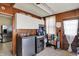 Laundry room with washer, dryer, cabinets, and exterior door at 704 Baronne St, Lebanon, IN 46052