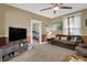 Comfortable living room with TV and adjacent workout area at 704 Baronne St, Lebanon, IN 46052