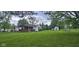 Beautiful home with a well-maintained yard, fence, and shed at 7639 N Frontage Rd, Fairland, IN 46126