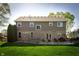 Large backyard featuring a patio and well-maintained lawn at 7926 White Pine Dr, Avon, IN 46123