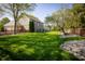 Large backyard with lush lawn, stone accents, and wooded perimeter at 7926 White Pine Dr, Avon, IN 46123