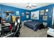 Eclectic bedroom in a playful blue color, a work station, and unique decorative items at 7926 White Pine Dr, Avon, IN 46123
