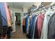 Walk-in closet with organized shelving and hanging space, connecting to the main bedroom at 7926 White Pine Dr, Avon, IN 46123