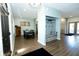 Open entryway with light blue walls, wood floors, and a convenient mudroom storage bench at 7926 White Pine Dr, Avon, IN 46123