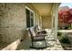 Welcoming covered front porch with rocking chairs overlooking landscaped yard at 7926 White Pine Dr, Avon, IN 46123