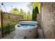 A relaxing hot tub with privacy lattice and decorative string lights at 7926 White Pine Dr, Avon, IN 46123