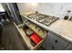 Modern kitchen featuring an organized drawer below the stovetop to store pots and pans at 7926 White Pine Dr, Avon, IN 46123