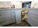 Kitchen showing granite countertops, gray cabinets, and corner cabinet with swivel shelves at 7926 White Pine Dr, Avon, IN 46123