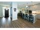 Open-concept kitchen with gray cabinets, a large island, and seamless access to the dining area at 7926 White Pine Dr, Avon, IN 46123