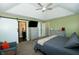 Bright main bedroom with barn door to bathroom, two dressers and seating area at 7926 White Pine Dr, Avon, IN 46123