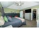 Well-lit main bedroom with vaulted ceiling, TV, barn door to bathroom and walk-in closet at 7926 White Pine Dr, Avon, IN 46123