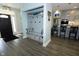 Mudroom with built-in bench, storage, and coat hooks leading into the kitchen at 7926 White Pine Dr, Avon, IN 46123