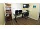 Home office with dual monitors, a comfortable chair, and a practical bookshelf for storage at 7926 White Pine Dr, Avon, IN 46123