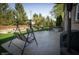 Spacious stamped concrete patio with patio furniture, swing, hot tub, and lush backyard at 7926 White Pine Dr, Avon, IN 46123