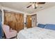 This bedroom features neutral walls, a ceiling fan, and ample closet space at 807 Whitmore St, Anderson, IN 46012