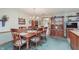Charming dining area with a wooden table, chairs, and built in china cabinet at 807 Whitmore St, Anderson, IN 46012