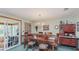 Traditional dining area with wooden table, chandelier lighting, and unique built in hutch at 807 Whitmore St, Anderson, IN 46012
