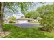 Lovely ranch-style home with brick exterior, spacious driveway, and mature trees in the yard at 807 Whitmore St, Anderson, IN 46012