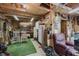 Interior of garage featuring ample storage space, a lounge chair, and hanging tools at 807 Whitmore St, Anderson, IN 46012