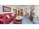Comfortable living room features plush seating, wood floors, and ample natural light at 807 Whitmore St, Anderson, IN 46012