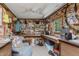 Workshop interior featuring storage, workbench, overhead lighting, and window at 807 Whitmore St, Anderson, IN 46012