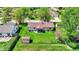 Aerial view of a home with a spacious, well-maintained yard, a shed, and mature trees at 8141 Rob Ln, Indianapolis, IN 46237