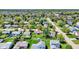 Aerial view of a suburban home with well-maintained yards, mature trees, and neighborhood streets at 8141 Rob Ln, Indianapolis, IN 46237
