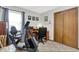 Versatile bedroom with exercise bike, work desk, closet, and natural light at 8141 Rob Ln, Indianapolis, IN 46237