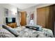 Well-lit bedroom with a cozy bed, modern decor, and ample storage space at 8141 Rob Ln, Indianapolis, IN 46237