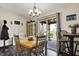 Bright dining room features a chandelier, sliding door access, and backyard views at 8141 Rob Ln, Indianapolis, IN 46237