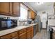 Well-equipped kitchen featuring wood cabinets, modern appliances, and efficient layout at 8141 Rob Ln, Indianapolis, IN 46237