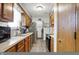 Well-equipped kitchen featuring wood cabinets, modern appliances, and efficient layout at 8141 Rob Ln, Indianapolis, IN 46237