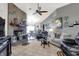 Comfortable living room features a stone fireplace, vaulted ceilings, and ample natural light at 8141 Rob Ln, Indianapolis, IN 46237