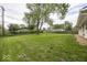 Expansive backyard with mature tree, green grass and wooden fence at 8145 Railroad Rd, Indianapolis, IN 46217