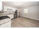 Well-lit kitchen with stainless steel appliances, granite countertops, and plenty of cabinet space for storage at 8145 Railroad Rd, Indianapolis, IN 46217