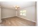 Inviting living room boasts gray walls, wood-look flooring, and a ceiling fan at 8145 Railroad Rd, Indianapolis, IN 46217