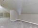 Attic space with unique sloped walls and ceiling, as well as gray carpeting at 820 Scotch Pine Dr, Greenwood, IN 46143