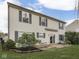 Home's exterior view, showcasing the lawn, patio, and vinyl siding at 820 Scotch Pine Dr, Greenwood, IN 46143