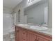 Bathroom featuring double sinks with granite countertops, a large mirror, and a shower/tub combo at 820 Scotch Pine Dr, Greenwood, IN 46143